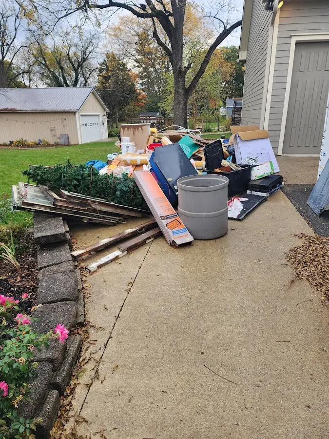 Dumpster being loaded with debris for 3 Yard Dumpster Rental in Montoursville